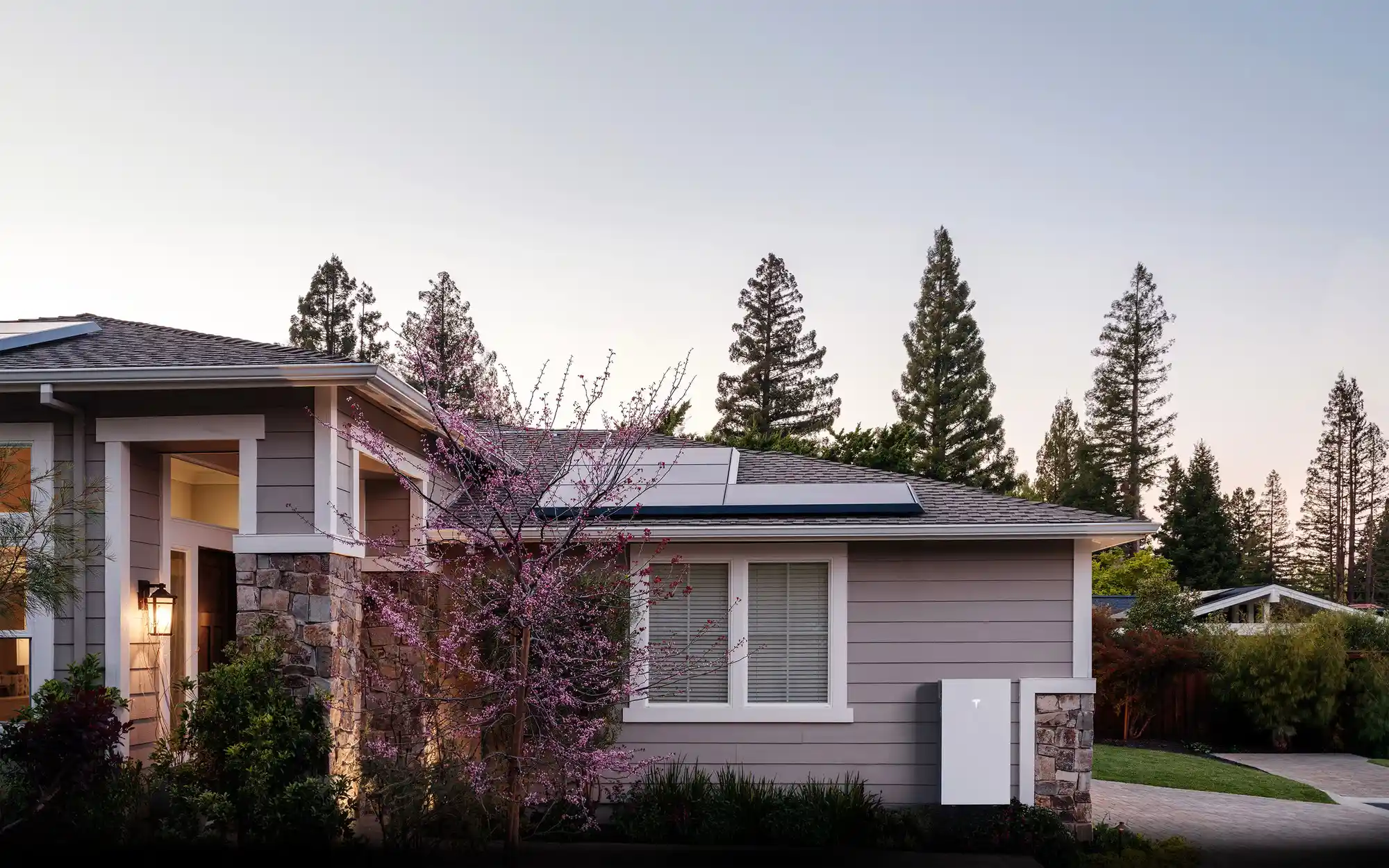 A home with solar panels installed on the roof, harnessing solar energy for sustainable power.
