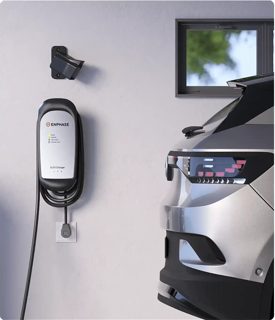 An EV charger mounted on a wall, with a car plugged in, ready for charging. The charger is labeled 'Enphase' and is designed for home use.