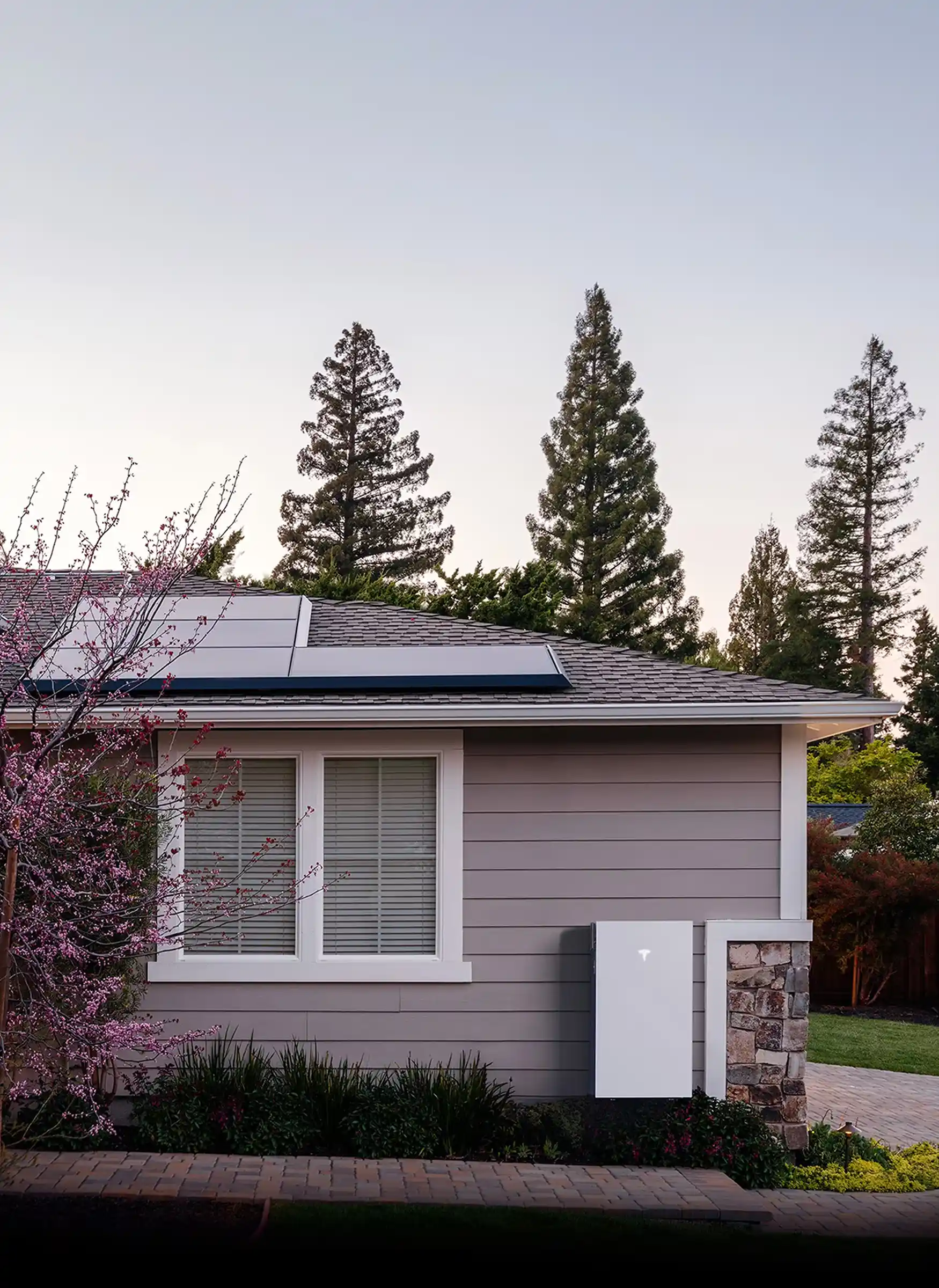 A home with solar panels installed on the roof, harnessing solar energy for sustainable power.